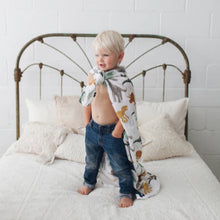 Load image into Gallery viewer, Little Unicorn Cotton Muslin Swaddle - Dino Friends
